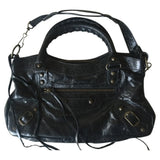 Balenciaga first black leather handbag