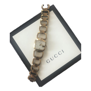 Gucci gold steel watch