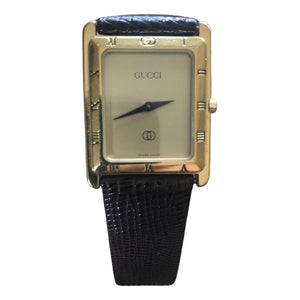 Gucci gold steel watch
