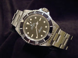 PRE OWNED MENS ROLEX STAINLESS STEEL SUBMARINER WITH A BLACK DIAL 14060
