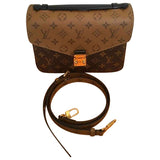 Louis Vuitton metis brown cloth handbag