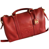 Chanel red leather travel bag
