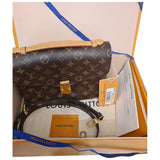 Louis Vuitton metis brown cloth clutch bag