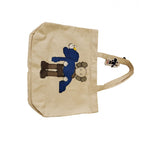 Kaws X Uniqlo ecru cloth handbag