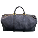 Chanel black leather travel bag