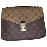 Louis Vuitton metis brown cloth handbag