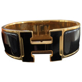 Hermès clic h black gold plated bracelets