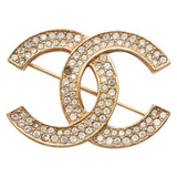 Chanel cc gold metal pins & brooches