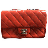 Chanel timeless/classique orange patent leather handbag