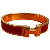 Hermès clic h red yellow gold bracelets