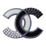 Chanel cc black metal pins & brooches