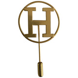 Hermès gold metal pins & brooches