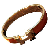 Hermès clic h orange metal bracelets