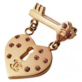 Chanel gold gold plated pins & brooches
