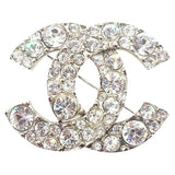 Chanel cc silver metal pins & brooches