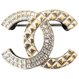 Chanel cc gold metal pins & brooches