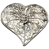 Chanel grey metal pins & brooches