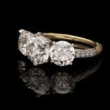 AN OLD EUROPEAN CUT DIAMOND THREE STONE RING IN PLATINUM AND 18CT GOLD BY HANCOCKS