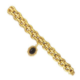AN ANTIQUE 18K YELLOW GOLD AND GARNET LOCKET BRACELET, CIRCA MID 1900\'S