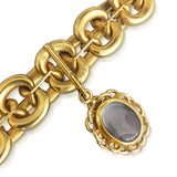 AN ANTIQUE 18K YELLOW GOLD AND GARNET LOCKET BRACELET, CIRCA MID 1900\'S