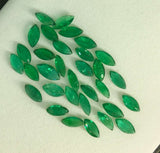 Suite of 32 loose Zambian Emeralds.