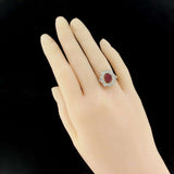 Ruby daisy ring with oval diamonds
