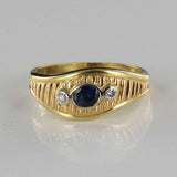 Asymmetrical diamonds sapphire ring