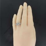 Emerald cut diamond ring with brilliant diamonds