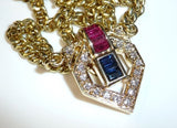 Necklace made of solid 14 kt / 585 gold with 1.35 ct ruby and sapphire baguette + 17 diamonds approx. 0.45 ct in total.