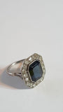 Antique ring in platinum, sapphire and diamond entourage