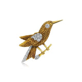 A DIAMOND AND YELLOW GOLD BIRD BROOCH