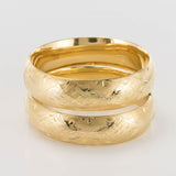 Pair of chunky bangles in chiseled gold