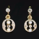 Two tone gold earrings with diamonds
