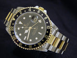 PRE OWNED MENS ROLEX TWO-TONE GMT-MASTER II WITH A BLACK DIAL 16713