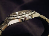PRE OWNED MENS ROLEX STAINLESS STEEL GMT-MASTER WITH A BLACK DIAL 16700