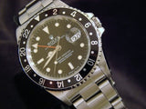 PRE OWNED MENS ROLEX STAINLESS STEEL GMT-MASTER WITH A BLACK DIAL 16700
