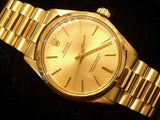 PRE OWNED MENS ROLEX YELLOW GOLD OYSTER PERPETUAL WITH A CHAMPAGNE DIAL 1003