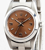 PRE OWNED LADIES ROLEX STAINLESS STEEL OYSTER PERPETUAL WITH A SALMON DIAL 76080