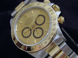 PRE OWNED MENS ROLEX TWO-TONE DAYTONA WITH A GOLD DIAL 16523