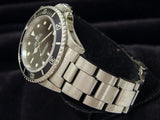 PRE OWNED MENS ROLEX STAINLESS STEEL SUBMARINER WITH A BLACK DIAL 14060