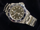 PRE OWNED MENS ROLEX STAINLESS STEEL SUBMARINER WITH A BLACK DIAL 14060
