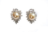 A pair of pearl and diamond ear clips
