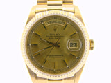 PRE OWNED MENS ROLEX YELLOW GOLD DAY-DATE WITH A GOLD/CHAMPAGNE DIAL 18038