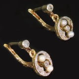 Two tone gold earrings with diamonds