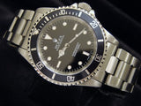 PRE OWNED MENS ROLEX STAINLESS STEEL SUBMARINER WITH A BLACK DIAL 14060