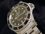PRE OWNED MENS ROLEX STAINLESS STEEL SUBMARINER WITH A BLACK DIAL 14060