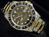 PRE OWNED MENS ROLEX TWO-TONE GMT-MASTER II WITH A BLACK DIAL 16713