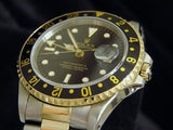 PRE OWNED MENS ROLEX TWO-TONE GMT-MASTER II WITH A BLACK DIAL 16713