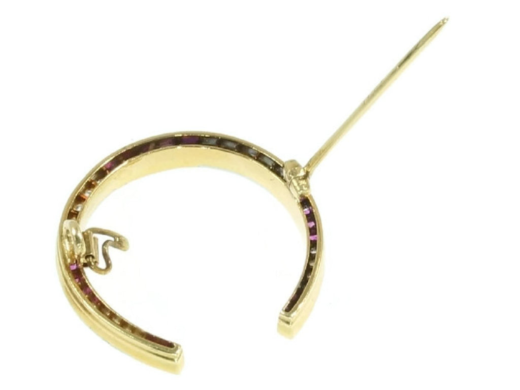 Art Deco horse shoe brooch with rubies